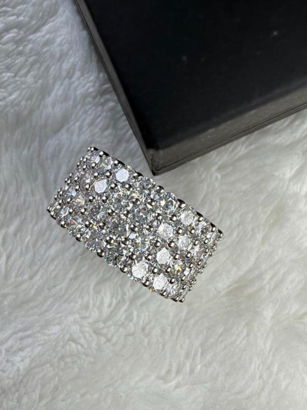 ring with multiple rows of round stones size 8...
